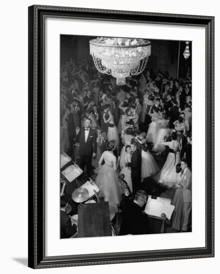 Young Couples at Formal Dance Dreamily Swaying on Crowded Floor of Dim, Chandelier-Lit Ballroom-Nina Leen-Framed Photographic Print