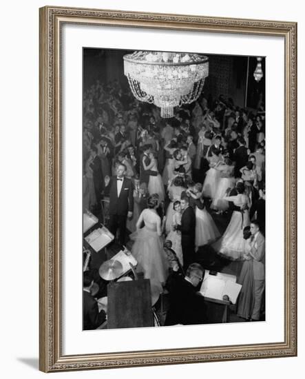 Young Couples at Formal Dance Dreamily Swaying on Crowded Floor of Dim, Chandelier-Lit Ballroom-Nina Leen-Framed Photographic Print