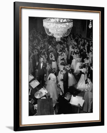 Young Couples at Formal Dance Dreamily Swaying on Crowded Floor of Dim, Chandelier-Lit Ballroom-Nina Leen-Framed Photographic Print