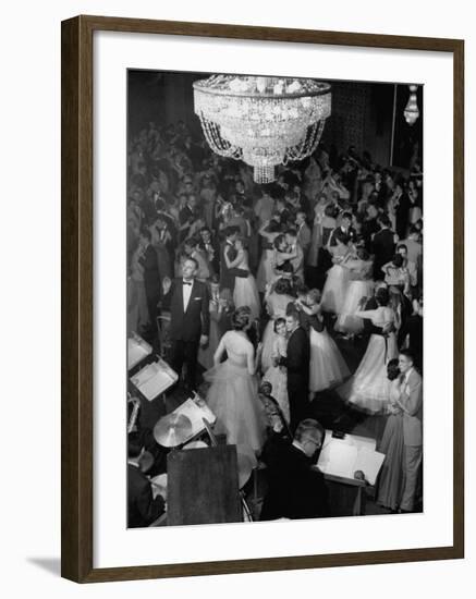 Young Couples at Formal Dance Dreamily Swaying on Crowded Floor of Dim, Chandelier-Lit Ballroom-Nina Leen-Framed Photographic Print