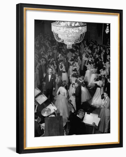Young Couples at Formal Dance Dreamily Swaying on Crowded Floor of Dim, Chandelier-Lit Ballroom-Nina Leen-Framed Photographic Print