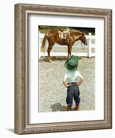 Young Cowboy Looking at Horse-William P. Gottlieb-Framed Photographic Print