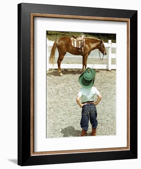 Young Cowboy Looking at Horse-William P. Gottlieb-Framed Photographic Print