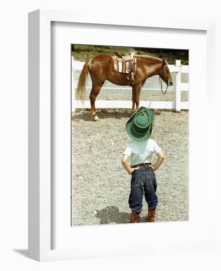 Young Cowboy Looking at Horse-William P. Gottlieb-Framed Photographic Print