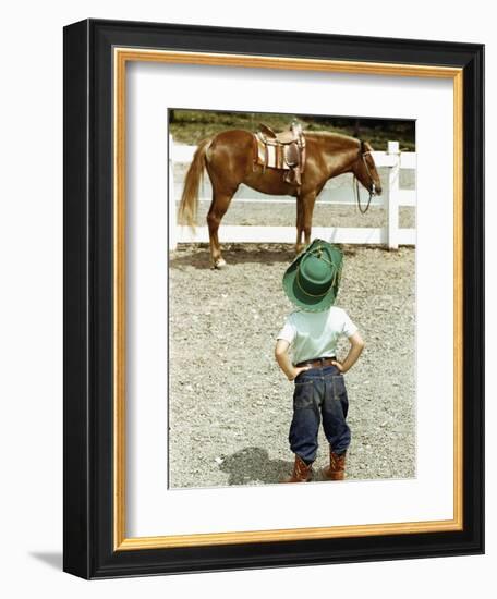 Young Cowboy Looking at Horse-William P. Gottlieb-Framed Photographic Print