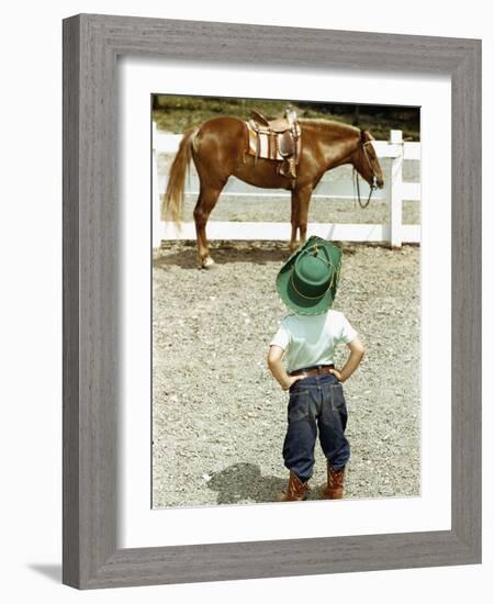 Young Cowboy Looking at Horse-William P. Gottlieb-Framed Photographic Print