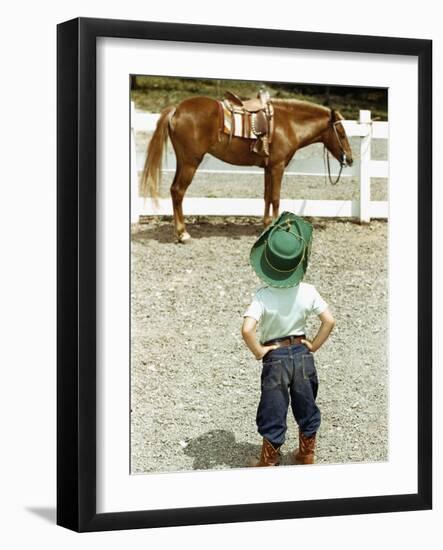 Young Cowboy Looking at Horse-William P. Gottlieb-Framed Photographic Print