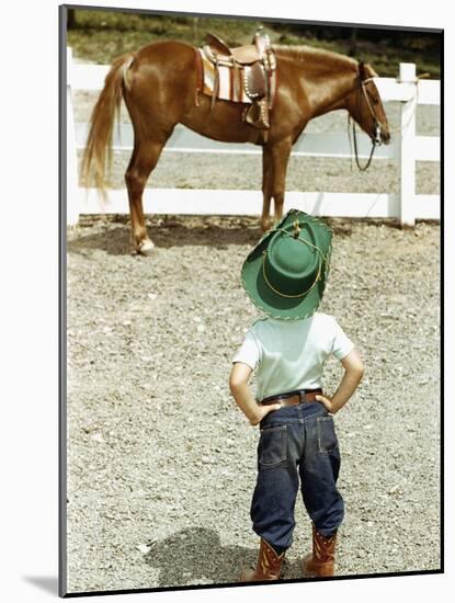 Young Cowboy Looking at Horse-William P. Gottlieb-Mounted Photographic Print