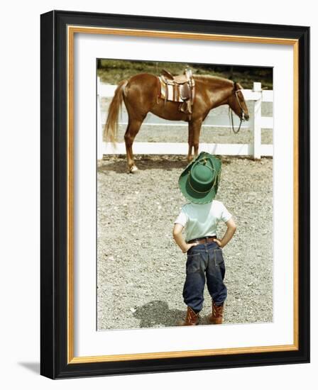 Young Cowboy Looking at Horse-William P. Gottlieb-Framed Photographic Print