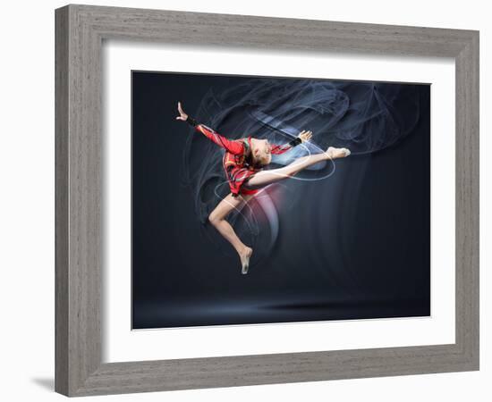 Young Cute Woman In Gymnast Suit Show Athletic Skill On Black Background-Sergey Nivens-Framed Art Print