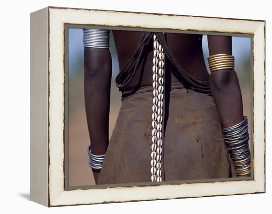 Young Dassanech Girl Wears a Leather Skirt, Metal Bracelets, Amulets and Bead Necklaces, Ethiopia-John Warburton-lee-Framed Premier Image Canvas