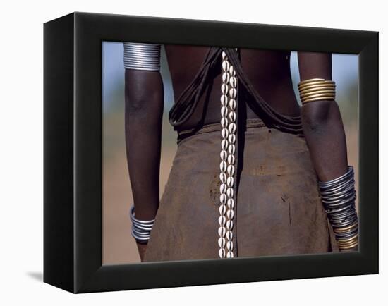 Young Dassanech Girl Wears a Leather Skirt, Metal Bracelets, Amulets and Bead Necklaces, Ethiopia-John Warburton-lee-Framed Premier Image Canvas