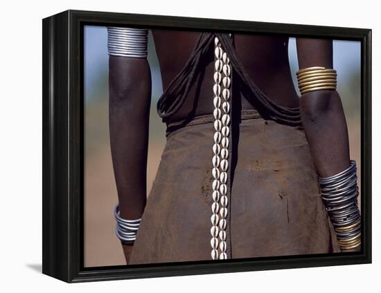 Young Dassanech Girl Wears a Leather Skirt, Metal Bracelets, Amulets and Bead Necklaces, Ethiopia-John Warburton-lee-Framed Premier Image Canvas