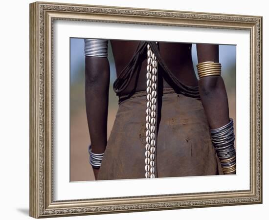 Young Dassanech Girl Wears a Leather Skirt, Metal Bracelets, Amulets and Bead Necklaces, Ethiopia-John Warburton-lee-Framed Photographic Print