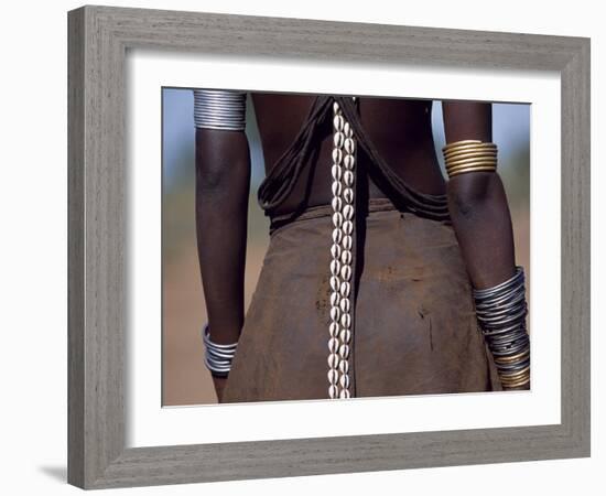 Young Dassanech Girl Wears a Leather Skirt, Metal Bracelets, Amulets and Bead Necklaces, Ethiopia-John Warburton-lee-Framed Photographic Print