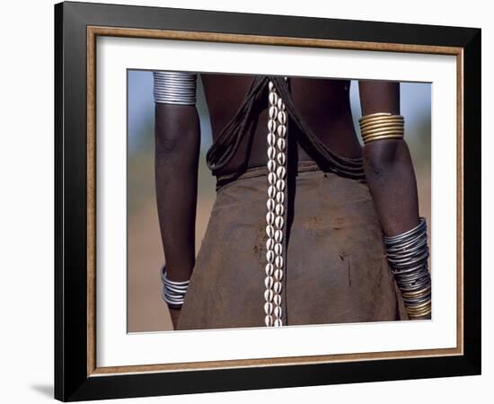 Young Dassanech Girl Wears a Leather Skirt, Metal Bracelets, Amulets and Bead Necklaces, Ethiopia-John Warburton-lee-Framed Photographic Print