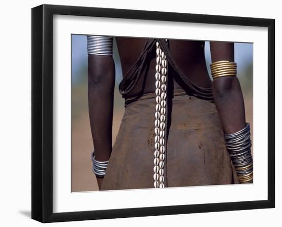 Young Dassanech Girl Wears a Leather Skirt, Metal Bracelets, Amulets and Bead Necklaces, Ethiopia-John Warburton-lee-Framed Photographic Print