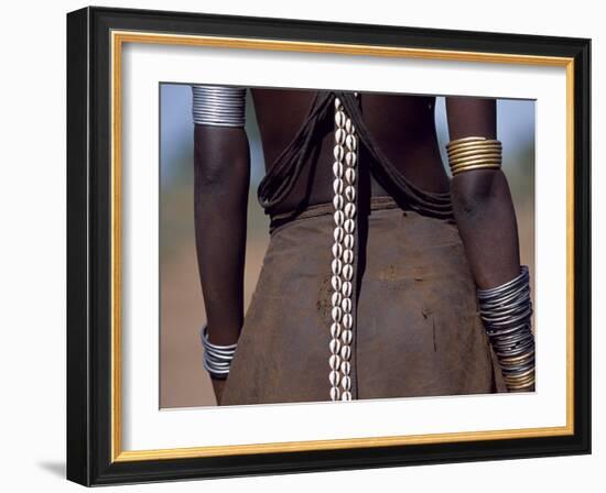 Young Dassanech Girl Wears a Leather Skirt, Metal Bracelets, Amulets and Bead Necklaces, Ethiopia-John Warburton-lee-Framed Photographic Print