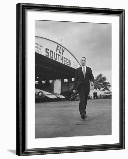 Young Exec Wearing a Brooks Brothers Type of Suit Walking around an Airport-null-Framed Photographic Print