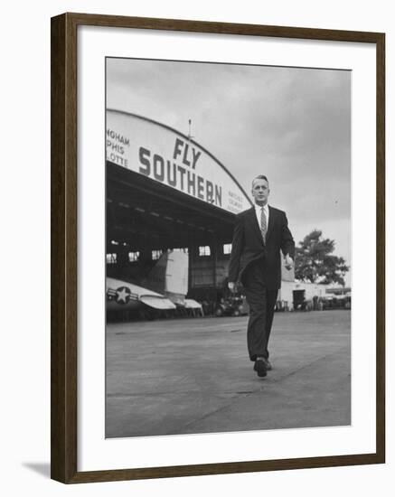 Young Exec Wearing a Brooks Brothers Type of Suit Walking around an Airport-null-Framed Photographic Print