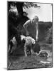Young Farm Boy Watching His Dog Sniff a Large Turtle at the Pond-Myron Davis-Mounted Photographic Print