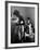 Young Father Helping His Wife Get Dressed as Their Sons Look On-Mark Kauffman-Framed Photographic Print