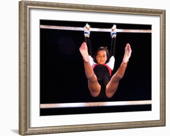 Young Female Gymnast on the Uneven Bars-Bill Bachmann-Framed Photographic Print