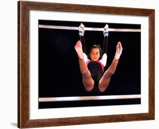 Young Female Gymnast on the Uneven Bars-Bill Bachmann-Framed Photographic Print