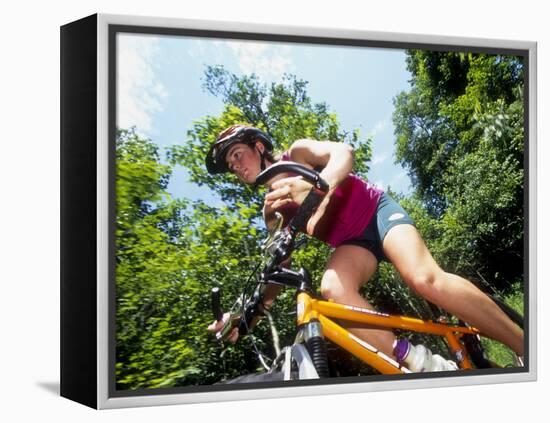 Young Female Recreational Mountain Biker Riding in the Forest-null-Framed Premier Image Canvas