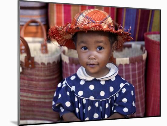 Young Girl Beside a Road-Side Stall Near Antananarivo, Capital of Madagascar-Nigel Pavitt-Mounted Photographic Print