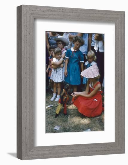 Young Girl in a Bonnet and a Red Dress Feeding an Organ Grinder's Monkey, Iowa State Fair, 1955-John Dominis-Framed Photographic Print