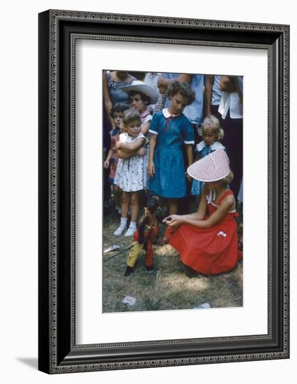 Young Girl in a Bonnet and a Red Dress Feeding an Organ Grinder's Monkey, Iowa State Fair, 1955-John Dominis-Framed Photographic Print