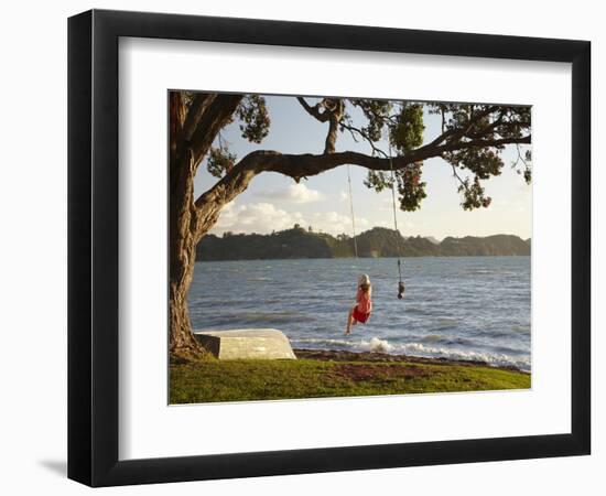 Young Girl on Rope Swing under Pohutukawa Tree, Oamaru Bay, Coromandel, North Island, New Zealand-David Wall-Framed Photographic Print