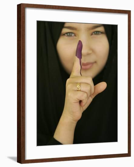 Young Girl Shows Her Inked Finger, Even Though She Was Too Young to Vote, in Karbala, Iraq-null-Framed Photographic Print