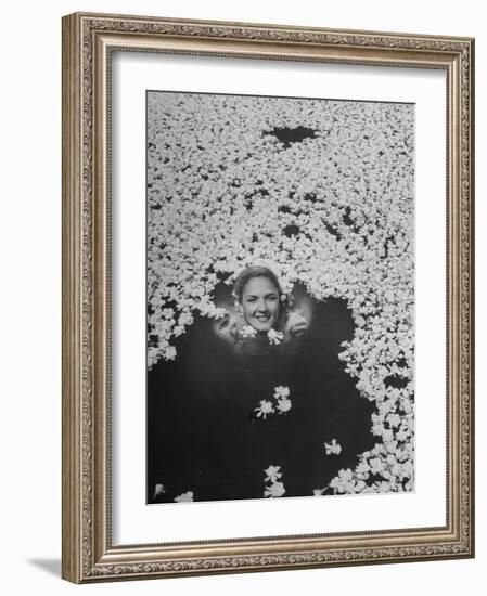 Young Girl Swimming in Pool Covered with Gardenia Blossoms-Eliot Elisofon-Framed Photographic Print