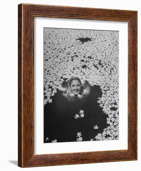 Young Girl Swimming in Pool Covered with Gardenia Blossoms-Eliot Elisofon-Framed Photographic Print