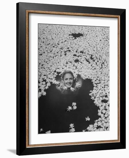 Young Girl Swimming in Pool Covered with Gardenia Blossoms-Eliot Elisofon-Framed Photographic Print