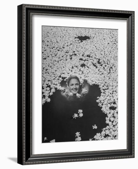 Young Girl Swimming in Pool Covered with Gardenia Blossoms-Eliot Elisofon-Framed Photographic Print