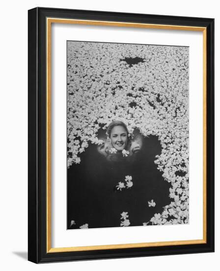 Young Girl Swimming in Pool Covered with Gardenia Blossoms-Eliot Elisofon-Framed Photographic Print