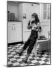 Young Girl Wearing Cowgirl Outfit Drinking Milk and Eating Sandwich in Kitchen-Nina Leen-Mounted Photographic Print