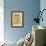 Young Girls Looks At a Selection of Old Needlepoints On a Wall-null-Framed Art Print displayed on a wall