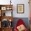 Young Girls Looks At a Selection of Old Needlepoints On a Wall-null-Framed Art Print displayed on a wall