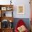 Young Girls Looks At a Selection of Old Needlepoints On a Wall-null-Framed Art Print displayed on a wall