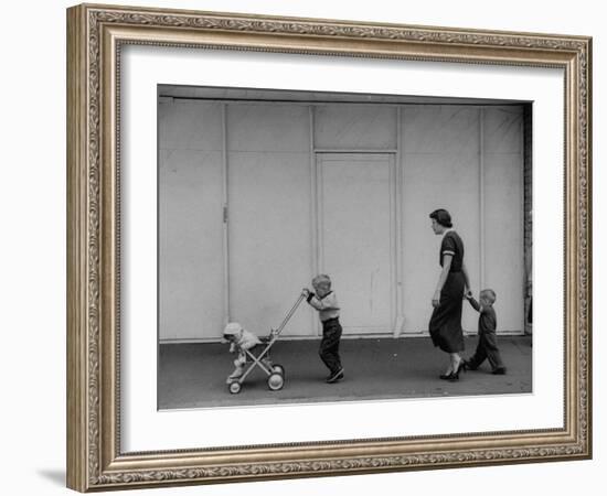 Young Housewife Walking with Her Three Children-Mark Kauffman-Framed Photographic Print