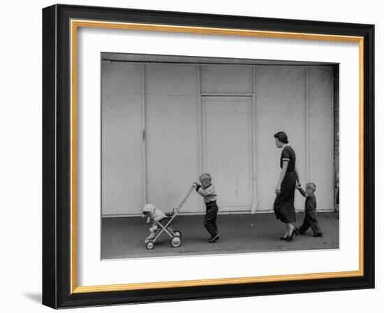 Young Housewife Walking with Her Three Children-Mark Kauffman-Framed Photographic Print