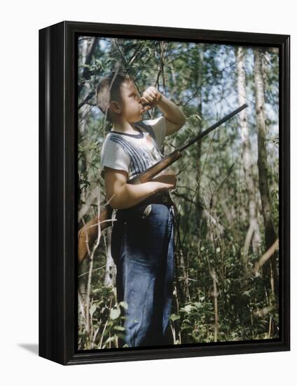 Young Hunter Blowing a Duck Decal Wistle while Holding His Rifle under His Arm-Al Fenn-Framed Premier Image Canvas