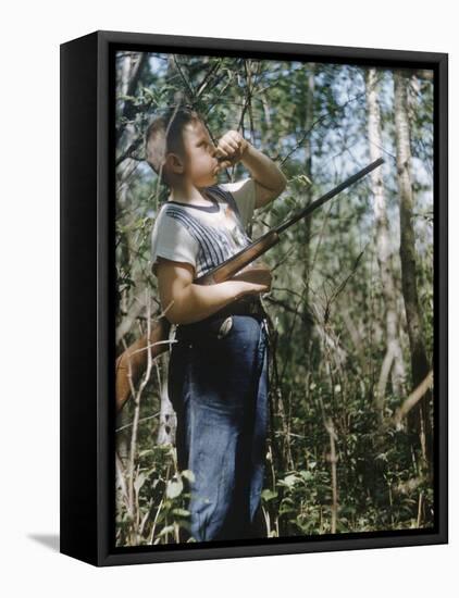 Young Hunter Blowing a Duck Decal Wistle while Holding His Rifle under His Arm-Al Fenn-Framed Premier Image Canvas