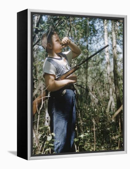 Young Hunter Blowing a Duck Decal Wistle while Holding His Rifle under His Arm-Al Fenn-Framed Premier Image Canvas