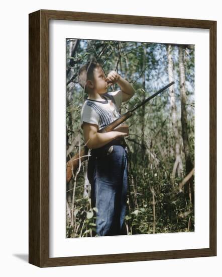 Young Hunter Blowing a Duck Decal Wistle while Holding His Rifle under His Arm-Al Fenn-Framed Photographic Print