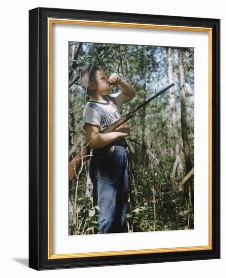 Young Hunter Blowing a Duck Decal Wistle while Holding His Rifle under His Arm-Al Fenn-Framed Photographic Print